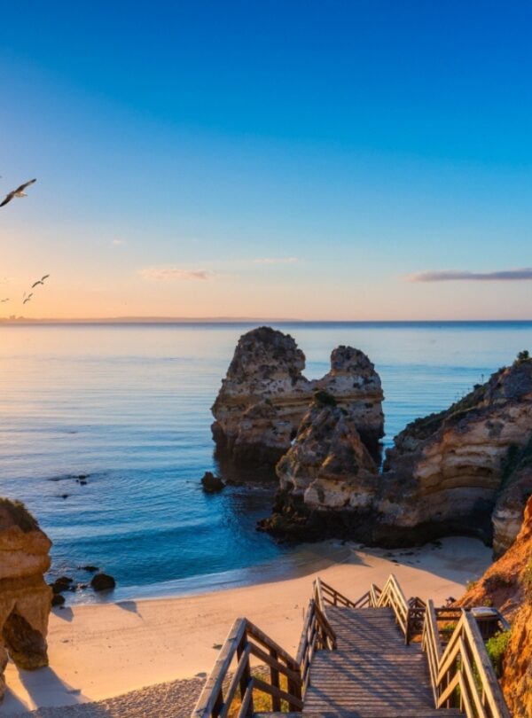 Golden sands and crashing waves of Nazaré Beach, Portugal – Discover Portugal's History and Live the Legend!