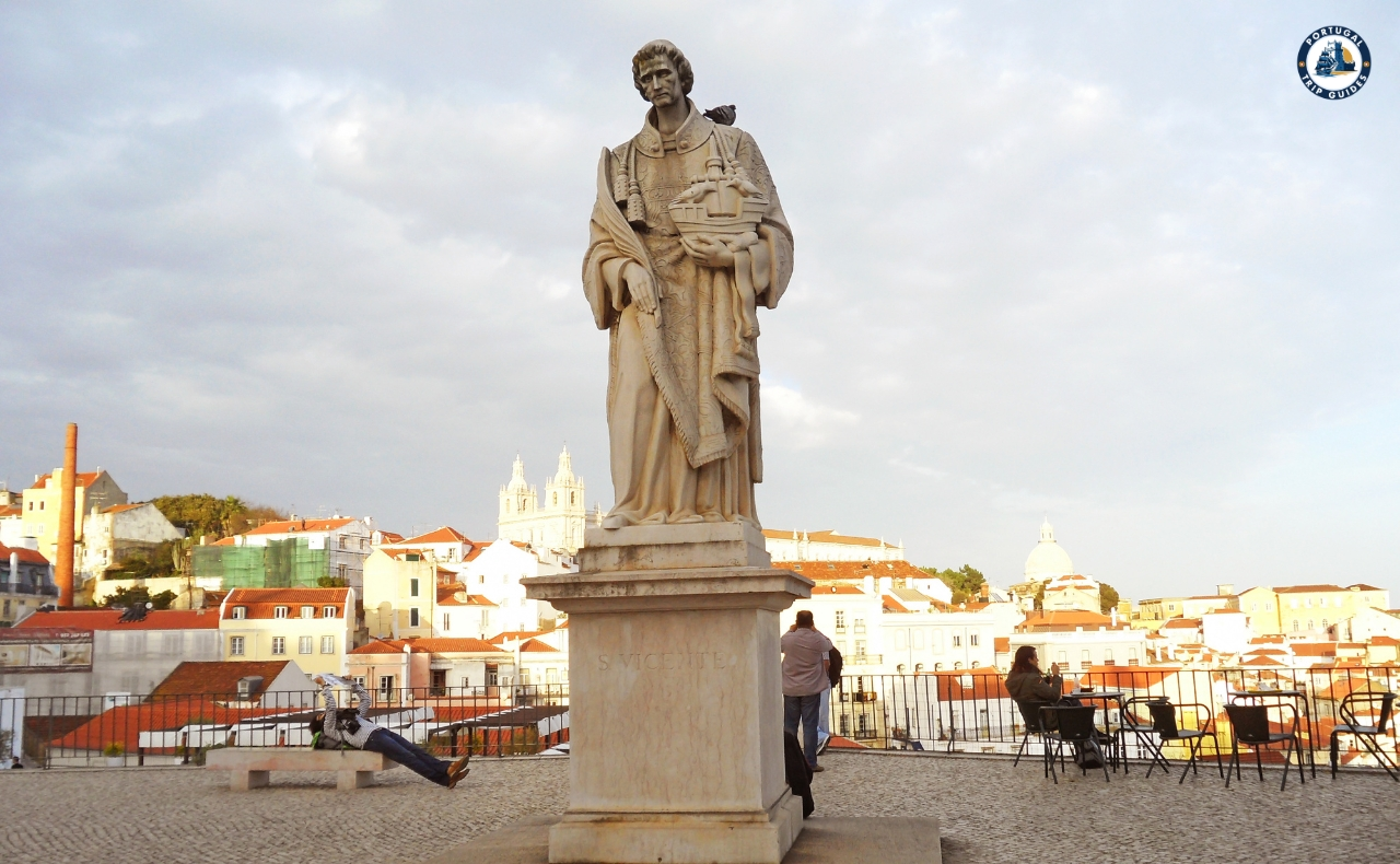 Colorful Alfama district in Lisbon with narrow streets, traditional houses, and tram – Explore Lisbon’s soul with PORTUGALTRIPGUIDES