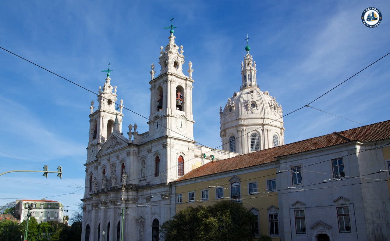 Colorful Alfama district in Lisbon with narrow streets, traditional houses, and tram – Explore Lisbon’s soul with PORTUGALTRIPGUIDES