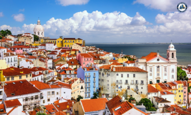 Colorful Alfama district in Lisbon with narrow streets, traditional houses, and tram – Explore Lisbon’s soul with PORTUGALTRIPGUIDES
