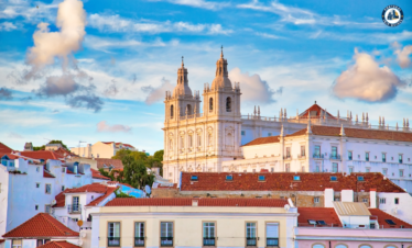 Colorful Alfama district in Lisbon with narrow streets, traditional houses, and tram – Explore Lisbon’s soul with PORTUGALTRIPGUIDES