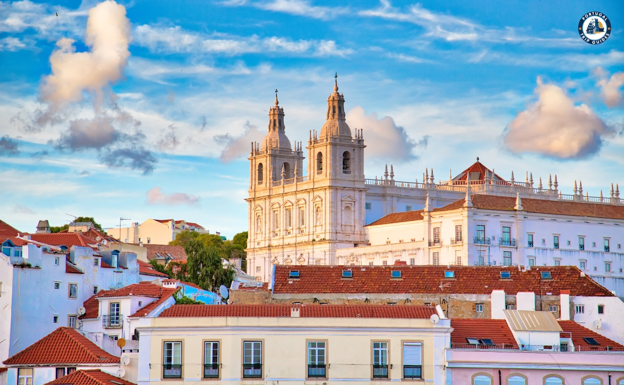 Colorful Alfama district in Lisbon with narrow streets, traditional houses, and tram – Explore Lisbon’s soul with PORTUGALTRIPGUIDES