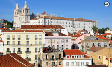 Colorful Alfama district in Lisbon with narrow streets, traditional houses, and tram – Explore Lisbon’s soul with PORTUGALTRIPGUIDES