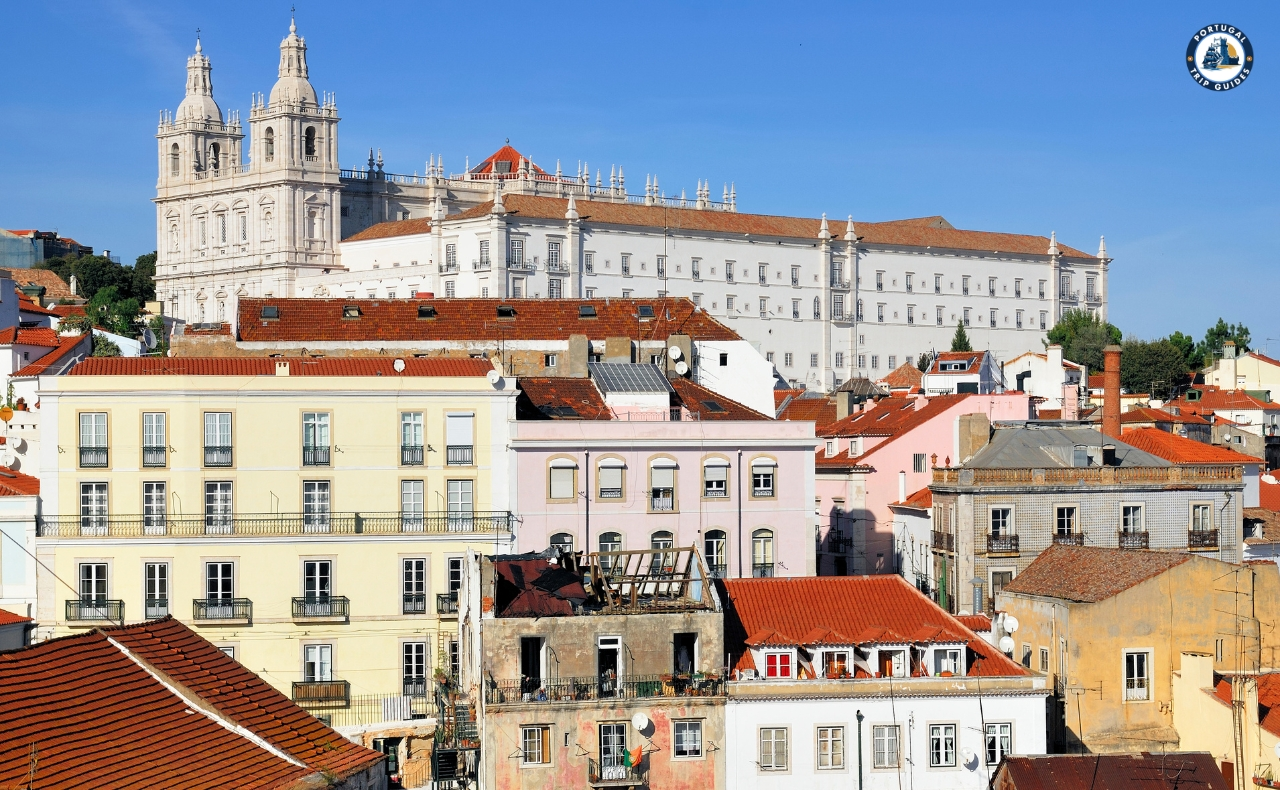 Colorful Alfama district in Lisbon with narrow streets, traditional houses, and tram – Explore Lisbon’s soul with PORTUGALTRIPGUIDES