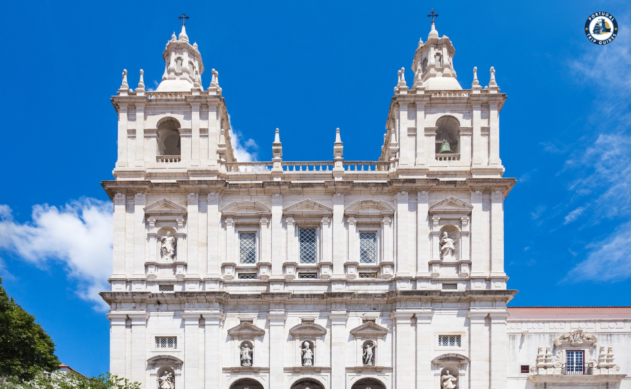 Colorful Alfama district in Lisbon with narrow streets, traditional houses, and tram – Explore Lisbon’s soul with PORTUGALTRIPGUIDES