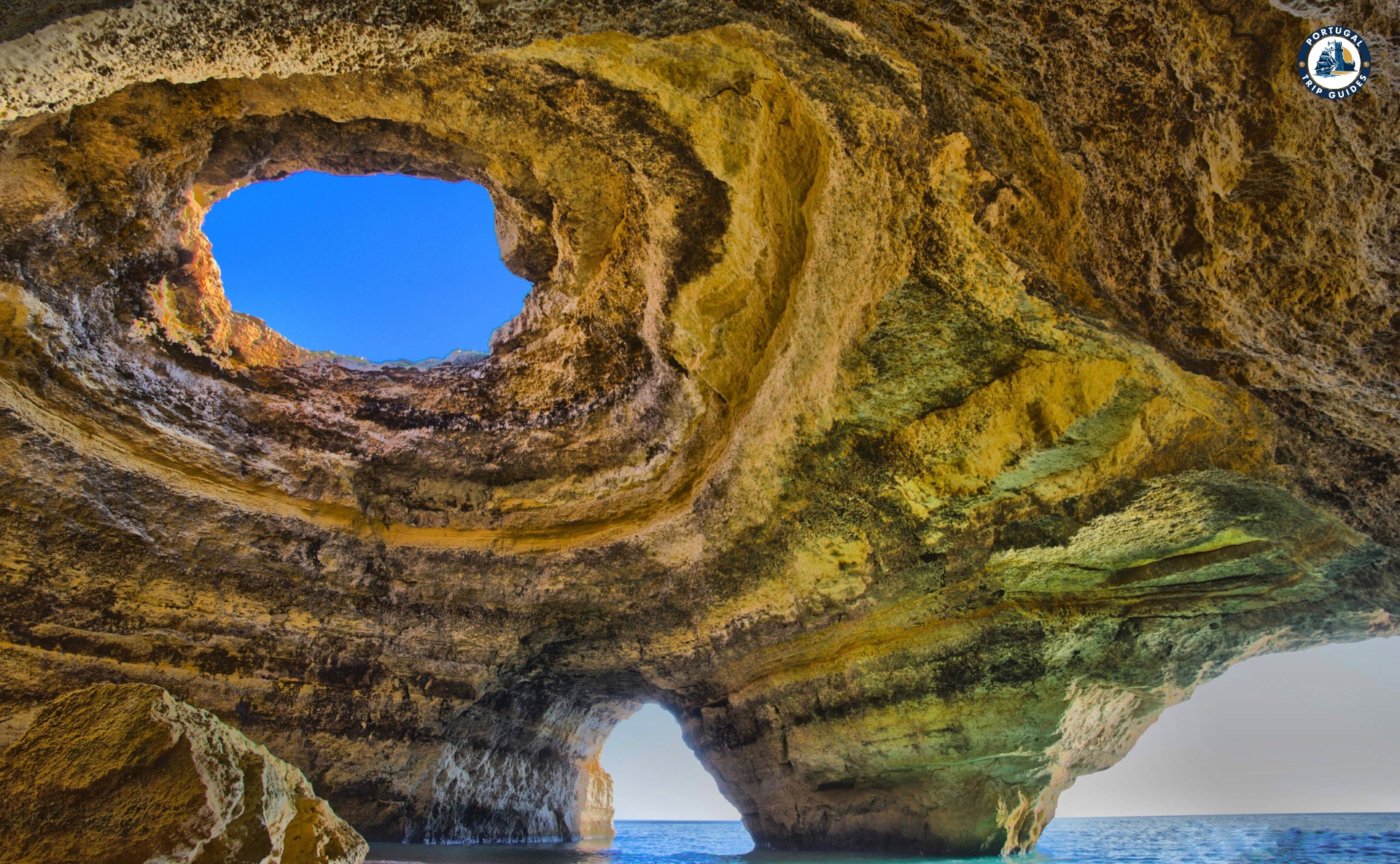 Benagil Sea Cave with sunlight streaming through the skylight – Discover Portugal's History and Live the Legend! | PORTUGALTRIPGUIDES